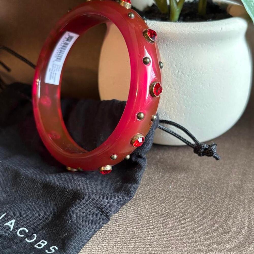 Marc Jacobs red bangle with red gemstones and gold studs
